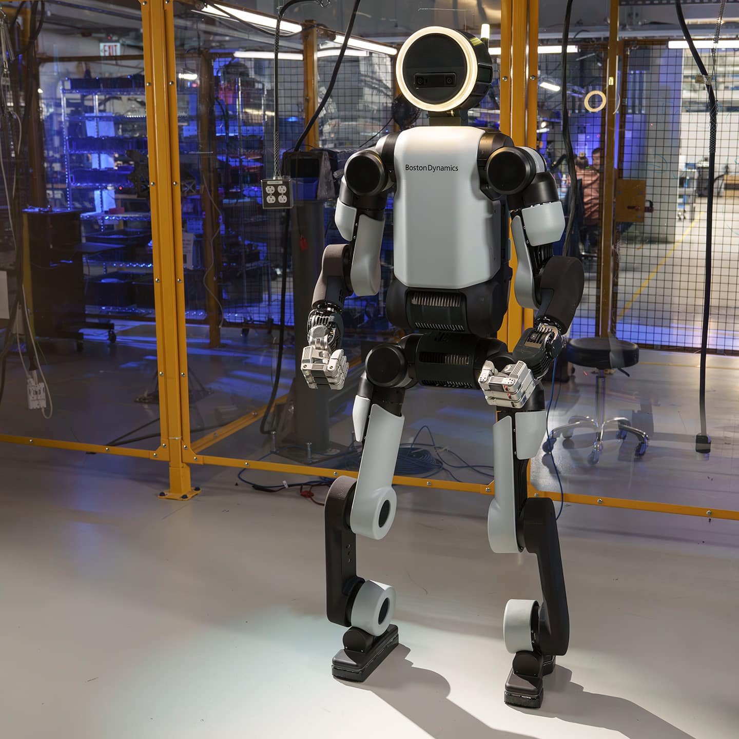 atlas-full-body-sq Atlas robot stands in a research lab